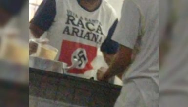 Imagem referente a Funcionária de escola vai trabalhar com camiseta com símbolo nazista no Paraná