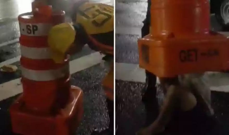 Homem fica entalado em cone de sinalização e precisa ser resgatado; veja vídeo