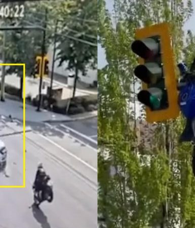 Imagem referente a Moto fica pendurada em semáforo após acidente impressionante; Veja vídeo