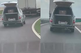 Carro funerário circula com tampa traseira aberta no Contorno Oeste; veja o vídeo Carro funerário circula com tampa traseira aberta no Contorno Oeste; veja o vídeo